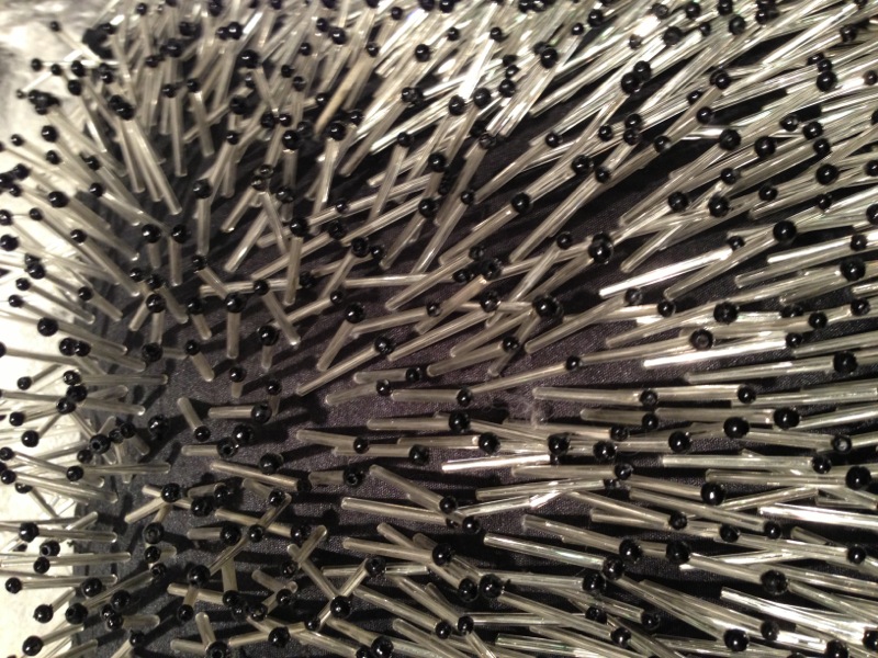 Can you believe this is a pillow? Porcupine without the spine we say! Aviva Stanoff makes the blingiest textiles and soft goods - and this is very touchable too1